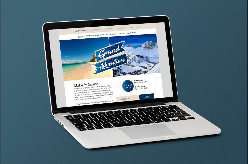 Grand Adventure website shown on a laptop